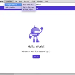 Aplikacja .NET MAUI z menu "Zmień lokalizację" otwartym, pokazującym opcje Nowy Jork, Berlin i Madryt.